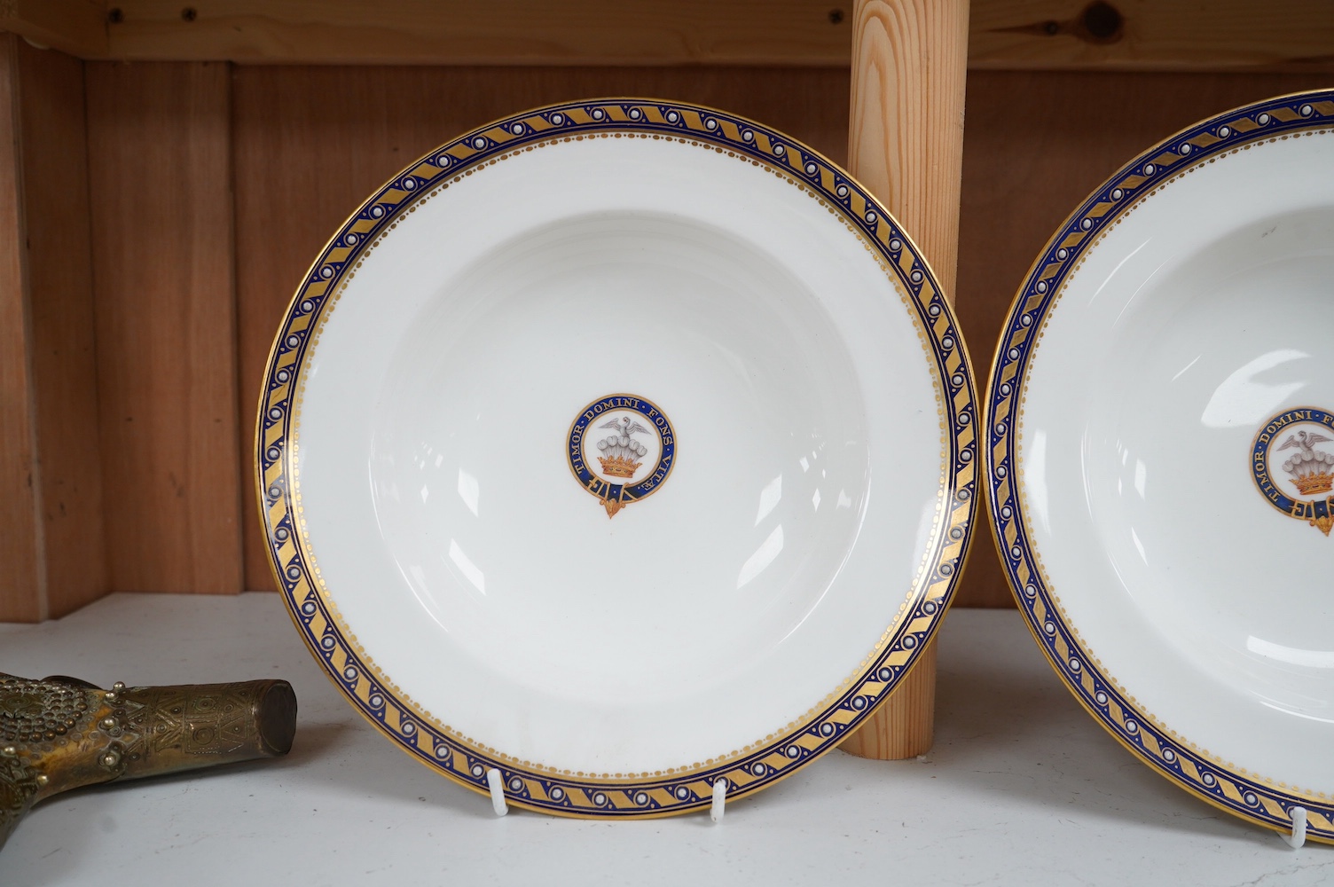 A pair of Minton armorial porcelain soup dishes with Latin motto, 25cm in diameter. Condition - good